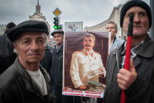 &lt;p&gt;Communist protesters in central Kyiv, Ukraine - A group of men stand at the top of a metro staircase in central Kyiv as protesters disperse from a Communist protest. They hold an old Soviet poster of Stalin, leader of the USSR. The poster says ”The people are waiting - I&amp;#39;ll be back soon”&lt;/p&gt;
