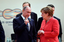 &lt;p&gt;Vladimir Putin i Angela Merkel&lt;/p&gt;
