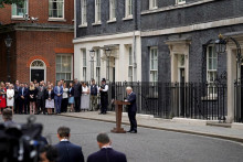 &lt;p&gt;Prime Minister Boris Johnson, watched by wife Carrie Johnson (centre holding daughter Romy), reads a statement outside 10 Downing Street, London, formally resigning as Conservative Party leader after ministers and MPs made clear his position was untenable. He will remain as Prime Minister until a successor is in place. Picture date: Thursday July 7, 2022. Photo: Gareth Fuller/PRESS ASSOCIATION&lt;/p&gt;
