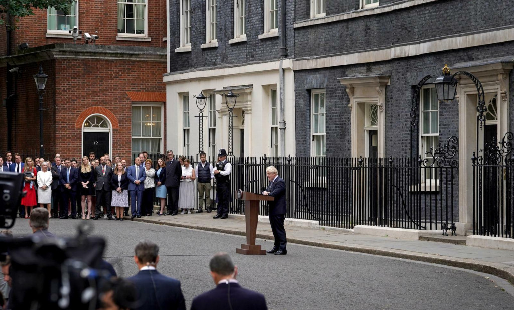 &lt;p&gt;Prime Minister Boris Johnson, watched by wife Carrie Johnson (centre holding daughter Romy), reads a statement outside 10 Downing Street, London, formally resigning as Conservative Party leader after ministers and MPs made clear his position was untenable. He will remain as Prime Minister until a successor is in place. Picture date: Thursday July 7, 2022. Photo: Gareth Fuller/PRESS ASSOCIATION&lt;/p&gt;
