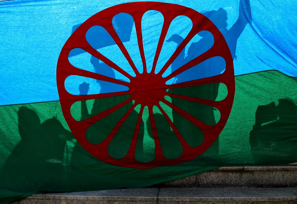&lt;p&gt;People cast shadows on the Roma flag during an anti-racism march by members of the Romanian Roma community celebrating the Romani Resistance Day in Bucharest, Romania, Saturday, May 18, 2019. On May 16, 1944 Roma prisoners in the Auschwitz concentration camp resisted an attempt by the Nazi troops to liquidate their camp, which postponed the action until August the same year. (AP Photo/Vadim Ghirda)&lt;/p&gt;